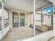 View of the screened porch with sliding glass doors leading into the interior at 310 Sunvista Ct, Sanford, FL 32773