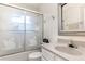 Bathroom with tub and swan design on glass shower door, features a neutral sink and vanity at 314 Silk Oak Dr, Kissimmee, FL 34743