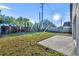 Enjoy this backyard with a brick wall, green grass, and a concrete patio perfect for outdoor entertaining at 3664 Sickle St, Orlando, FL 32812