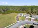 Aerial view of two-story homes in a neighborhood showcasing expansive lots and the proximity to the wooded conservation area at 3916 Clipstone Pl, Sanford, FL 32773