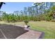 View from patio to fenced backyard surrounded by lush greenery offering a private and serene outdoor space at 3916 Clipstone Pl, Sanford, FL 32773