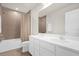 Clean bathroom featuring double sinks, a large mirror, and tiled shower with curtain at 3916 Clipstone Pl, Sanford, FL 32773