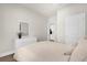 Clean bedroom with white walls, hardwood floors, and natural lighting at 3916 Clipstone Pl, Sanford, FL 32773