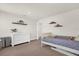 Neutral Bedroom with a white crib, natural light, and decorative shelving for storage solutions at 3916 Clipstone Pl, Sanford, FL 32773