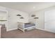 Neutral Bedroom space with a white crib and decorative shelving for displaying accessories at 3916 Clipstone Pl, Sanford, FL 32773