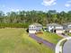 Beautiful two-story home with a brick paver driveway, well-manicured lawn, and mature landscaping adding curb appeal at 3916 Clipstone Pl, Sanford, FL 32773