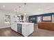 Bright kitchen with white island, stainless steel appliances, and hardwood floors at 3916 Clipstone Pl, Sanford, FL 32773