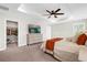 Relaxing main bedroom boasts a tray ceiling, ceiling fan, walk-in closet, and serene ambiance at 3916 Clipstone Pl, Sanford, FL 32773