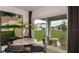 Dining area view showcasing a glass sliding door and view of the backyard at 5169 Forget Me Not Ave, Lake Hamilton, FL 33851