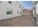 Open carport area features red brick pavers, attached to home for convenient parking with an installed electric car charging station at 6068 Peaceful Pkwy, Clermont, FL 34714