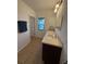 Bathroom featuring double sinks and granite countertops at 622 Samuel Pl, Davenport, FL 33837