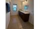 Bathroom featuring a double vanity, granite countertops, and tiled floor at 622 Samuel Pl, Davenport, FL 33837