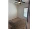 Bedroom with neutral carpeting, a ceiling fan, and a window letting in natural light at 622 Samuel Pl, Davenport, FL 33837