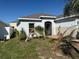 Exterior view of home showing arched entry way at 622 Samuel Pl, Davenport, FL 33837