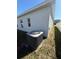 Exterior showcasing an HVAC unit, lush lawn and the property's well-maintained siding at 622 Samuel Pl, Davenport, FL 33837