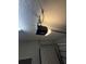 Image shows the garage door opener and hardware mounted to the ceiling in the garage at 622 Samuel Pl, Davenport, FL 33837