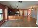 Kitchen featuring wood cabinets, granite countertops, stainless steel appliances, and tile flooring at 622 Samuel Pl, Davenport, FL 33837