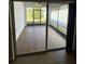 Enclosed patio with tile flooring, ceiling fan, and seamless transition to the outdoors at 622 Samuel Pl, Davenport, FL 33837