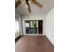 Enclosed patio with tile flooring, ceiling fan, and seamless transition to the outdoors at 622 Samuel Pl, Davenport, FL 33837