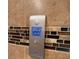 Modern digital shower control panel on tiled wall at 622 Samuel Pl, Davenport, FL 33837