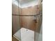 Tiled walk-in shower with glass door and modern fixtures at 622 Samuel Pl, Davenport, FL 33837