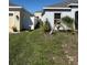 Side yard with lush grass and some landscaping at 622 Samuel Pl, Davenport, FL 33837