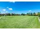 A green community sports field featuring a soccer goal and trimmed walking path at 7587 Oakmoss Loop, Davenport, FL 33837