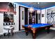 Fun game room featuring a pool table, arcade games, and decorative Star Wars elements at 7587 Oakmoss Loop, Davenport, FL 33837