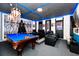 Entertainment room with a pool table, Star Wars decor, and comfortable seating at 7587 Oakmoss Loop, Davenport, FL 33837