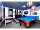 Entertainment room with a pool table, air hockey, and Star Wars themed decor at 7587 Oakmoss Loop, Davenport, FL 33837