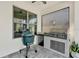 Built-in outdoor kitchen with stainless steel grill and Big Green Egg smoker at 8330 Vivaro Isle Way, Windermere, FL 34786