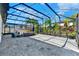 Outdoor patio featuring a seating area, potted plants, paver flooring and a covered screened enclosure for relaxing and entertaining at 8330 Vivaro Isle Way, Windermere, FL 34786