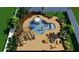 Aerial view of a pool with chairs, firepit, and lush landscaping at 8330 Vivaro Isle Way, Windermere, FL 34786
