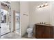 Bright bathroom with a view of the pool and outdoor seating at 8814 Southern Breeze Dr, Orlando, FL 32836