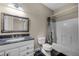 Bathroom with white vanity, granite countertop, square framed mirror, and shower and tub combo at 8814 Southern Breeze Dr, Orlando, FL 32836