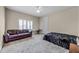 Bedroom with a ceiling fan, a sofa, bed, and carpeted floors at 8814 Southern Breeze Dr, Orlando, FL 32836