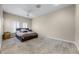 Bedroom features neutral walls, carpet, a ceiling fan, and two large windows with shutters at 8814 Southern Breeze Dr, Orlando, FL 32836