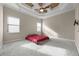 Bedroom with a ceiling fan and plush carpet at 8814 Southern Breeze Dr, Orlando, FL 32836