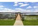 Scenic view of the dock and gazebo overlooking the water with a 'No Diving' sign at 8814 Southern Breeze Dr, Orlando, FL 32836