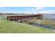 Scenic view of a wooden dock extending into the water, offering waterfront access and a relaxing atmosphere at 8814 Southern Breeze Dr, Orlando, FL 32836