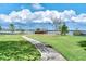 Scenic view of the dock and gazebo overlooking the water with a sidewalk at 8814 Southern Breeze Dr, Orlando, FL 32836