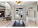 Welcoming foyer with marble floors, high ceilings, and views of the pool area at 8814 Southern Breeze Dr, Orlando, FL 32836