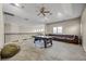 Spacious game room with pool table, comfortable seating and neutral carpet at 8814 Southern Breeze Dr, Orlando, FL 32836