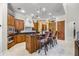 Gourmet kitchen with granite countertops, an island with seating, and custom cabinetry at 8814 Southern Breeze Dr, Orlando, FL 32836