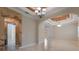 Spacious living room featuring marble floors, neutral walls, and decorative arches at 8814 Southern Breeze Dr, Orlando, FL 32836