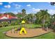 Well-maintained playground with a slide, swing set, and mulch ground cover, perfect for outdoor fun at 8814 Southern Breeze Dr, Orlando, FL 32836