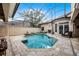 Relaxing screened pool with a cozy fireplace and ample seating area for outdoor entertainment and leisure at 8814 Southern Breeze Dr, Orlando, FL 32836