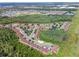 An aerial view of the community, including pool, pond, and basketball court at 9568 Muse Pl, Orlando, FL 32829