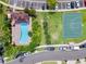 Top-down aerial view of the community pool, basketball court and parking at 9568 Muse Pl, Orlando, FL 32829