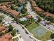 Aerial view of the community, including pool, pond, and basketball court at 9568 Muse Pl, Orlando, FL 32829